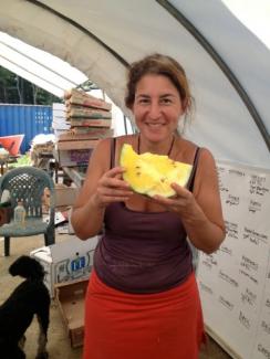 Laura Meister breaks for watermelon, at her Farm Girl Farm.